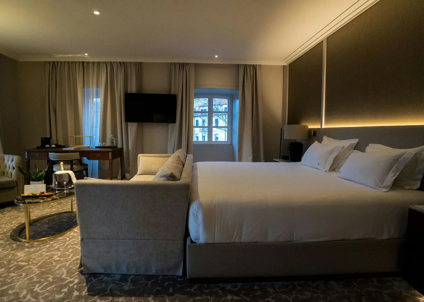Luxury hotel room with king-size bed and seating area